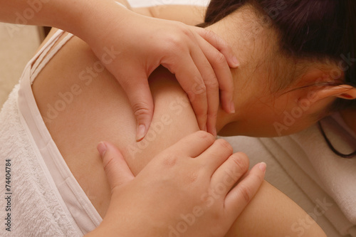 Closeup  of relaxing woman having massage on her neck