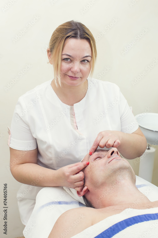 man in a beauty salon facial and massage
