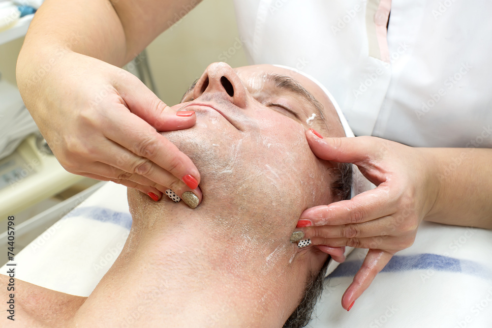 man in a beauty salon facial and massage man in a beauty salon facial and massage