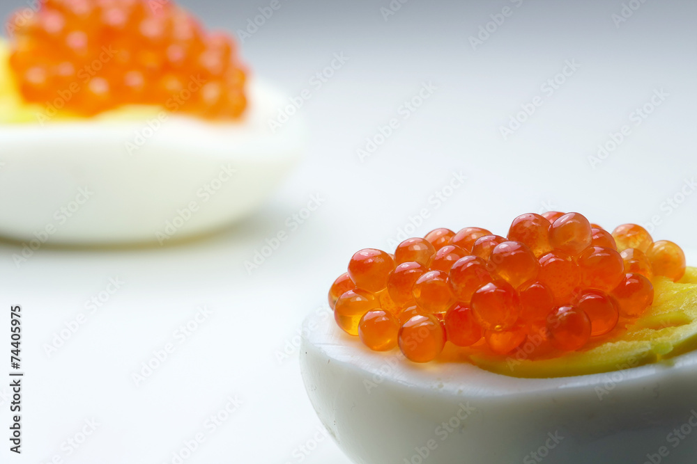 red caviar on half eggs, unusual perspective, copy space red caviar on half eggs, unusual perspective, copy space