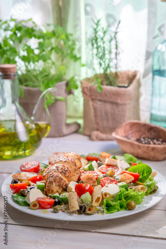 Caesar salad with fresh spring vegetables