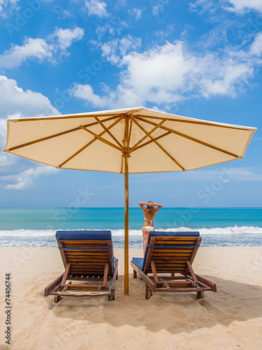 Lady relaxing on the beach in Bali © Netfalls