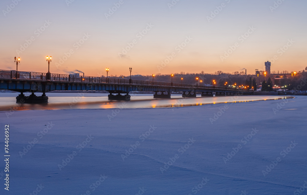 Bridge city landscape in snowy winter night
