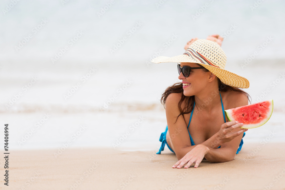 woman with watermelon at the seashore