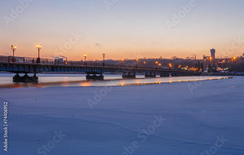 Bridge city landscape in snowy winter night © Ryzhkov Oleksandr