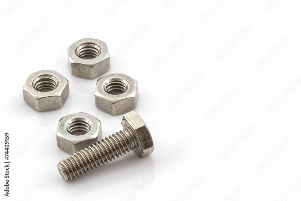 Metal screw and nuts on white background. Metal screw and nuts on white background.