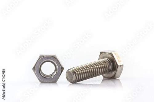 Metal screw and nuts on white background.
