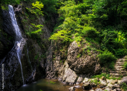 Waterfall over a mossy creek taken in Wanju  South Korea