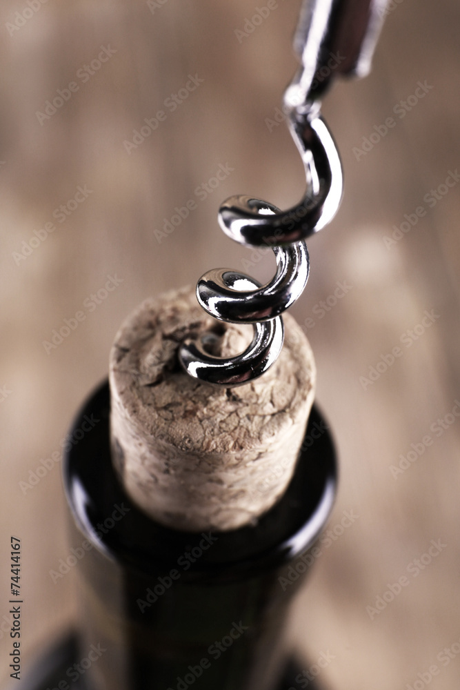 Bottle opener close-up, on wooden background Bottle opener close-up, on wooden background