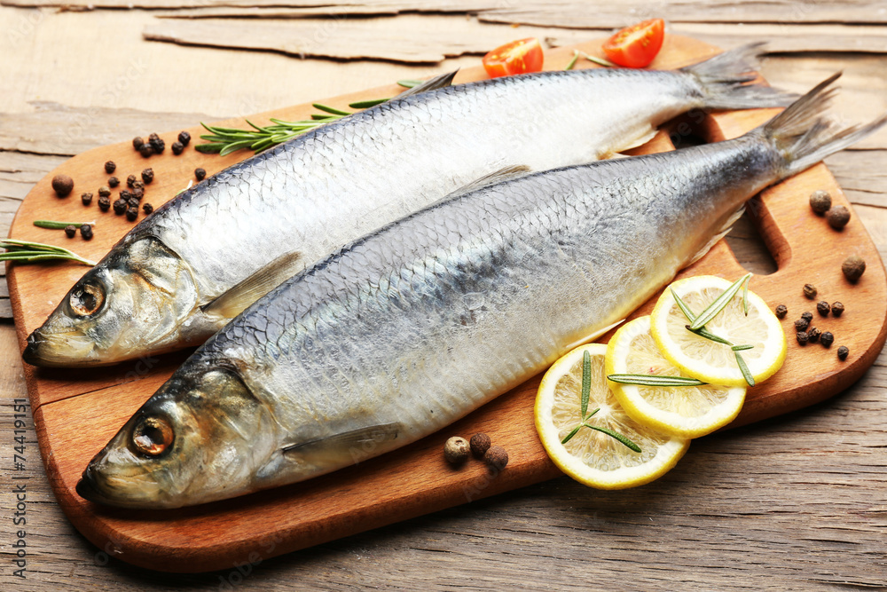Fresh raw fish and food ingredients on table Fresh raw fish and food ingredients on table