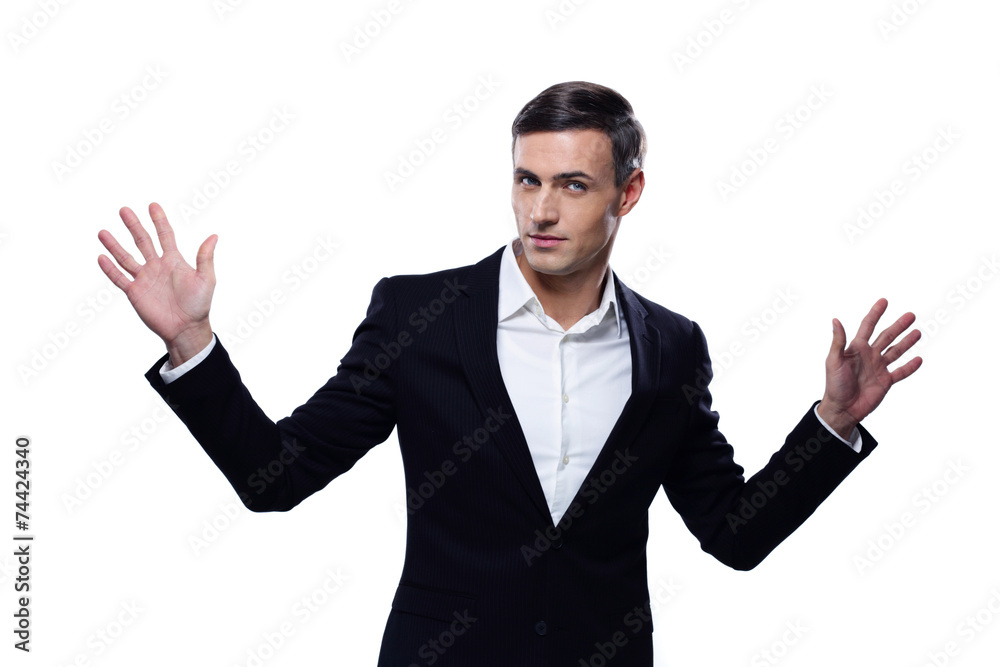 Happy businessman standing with hands on the sides Happy businessman standing with hands on the sides