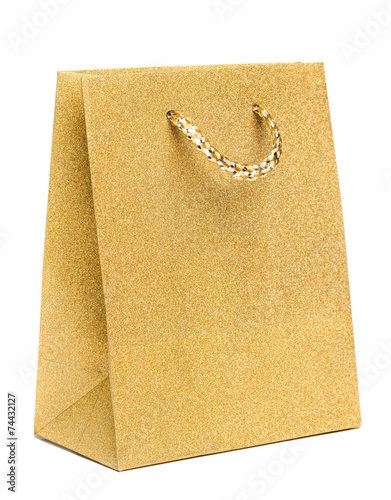 golden gift bag isolated on white background