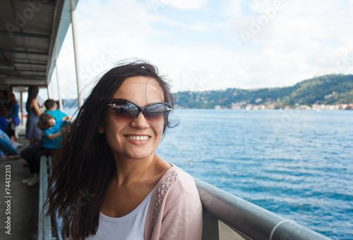 Young woman girl in sunglasses during Bosphorus cruise