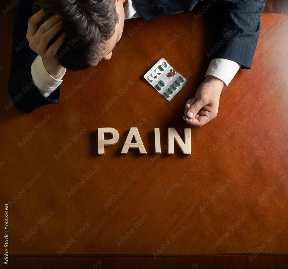 Obraz premium Word Pain and devastated man composition