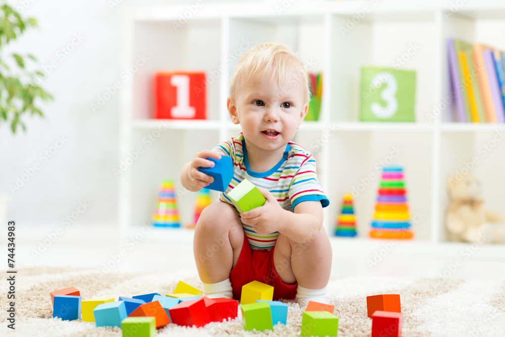 kid boy playing wooden toys kid boy playing wooden toys