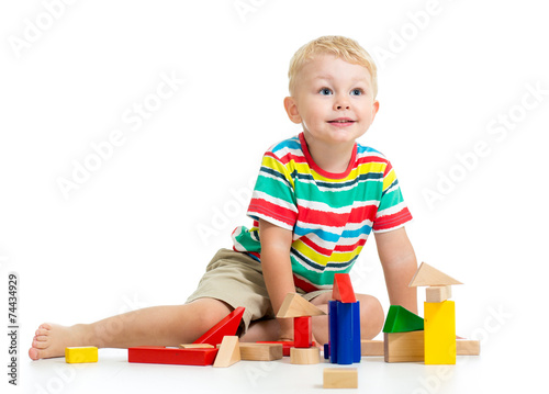 kid boy playing  wooden toys
