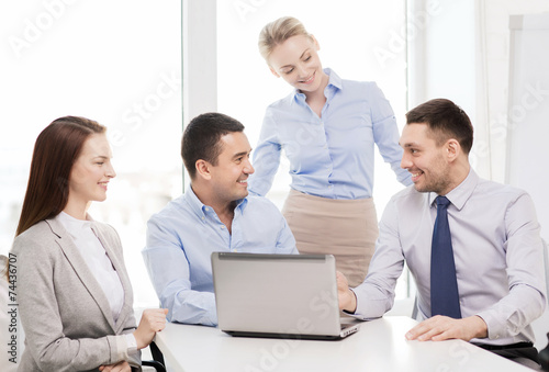 business team working with laptop in office