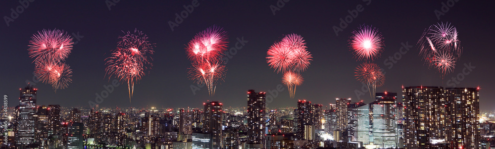 Fireworks celebrating over Tokyo cityscape at night Fireworks celebrating over Tokyo cityscape at night