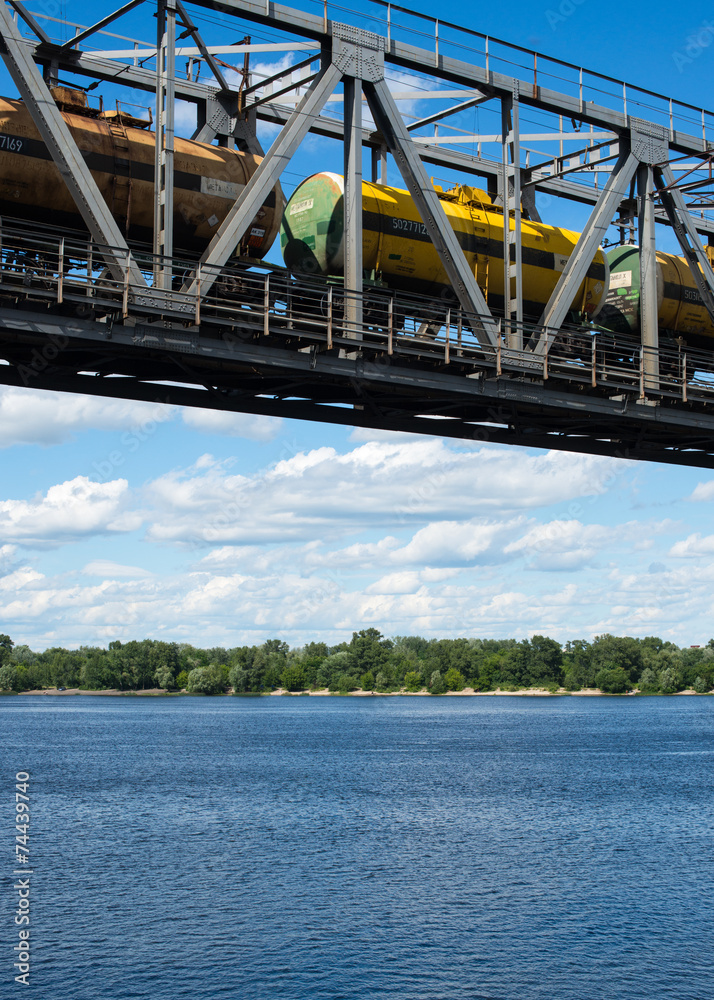 The span of the railroad bridge with freight train on it