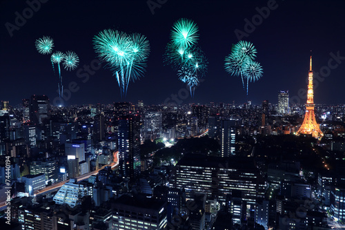 Fireworks celebrating over Tokyo cityscape at night