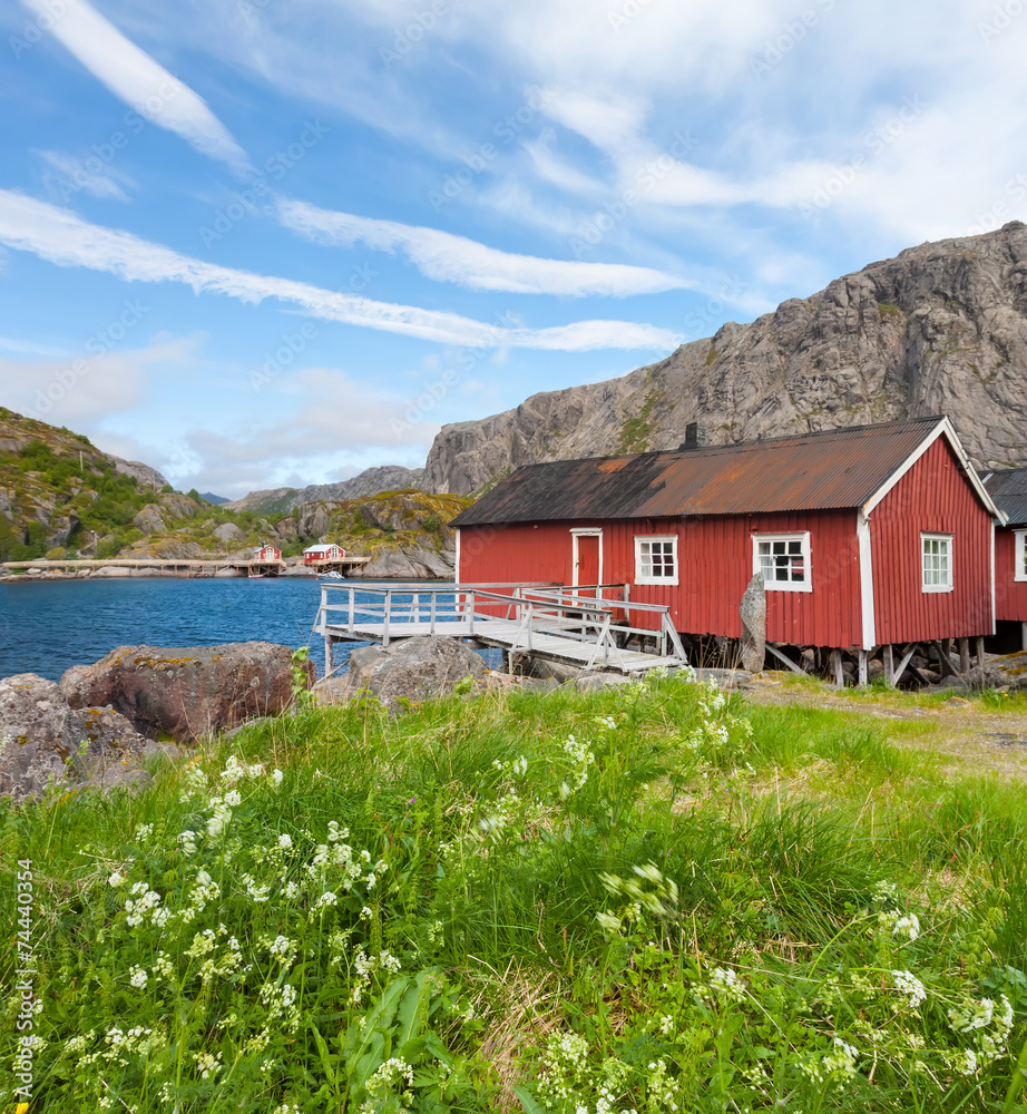 Fototapeta premium Typical red rorbu fishing hut in village Nusfjord