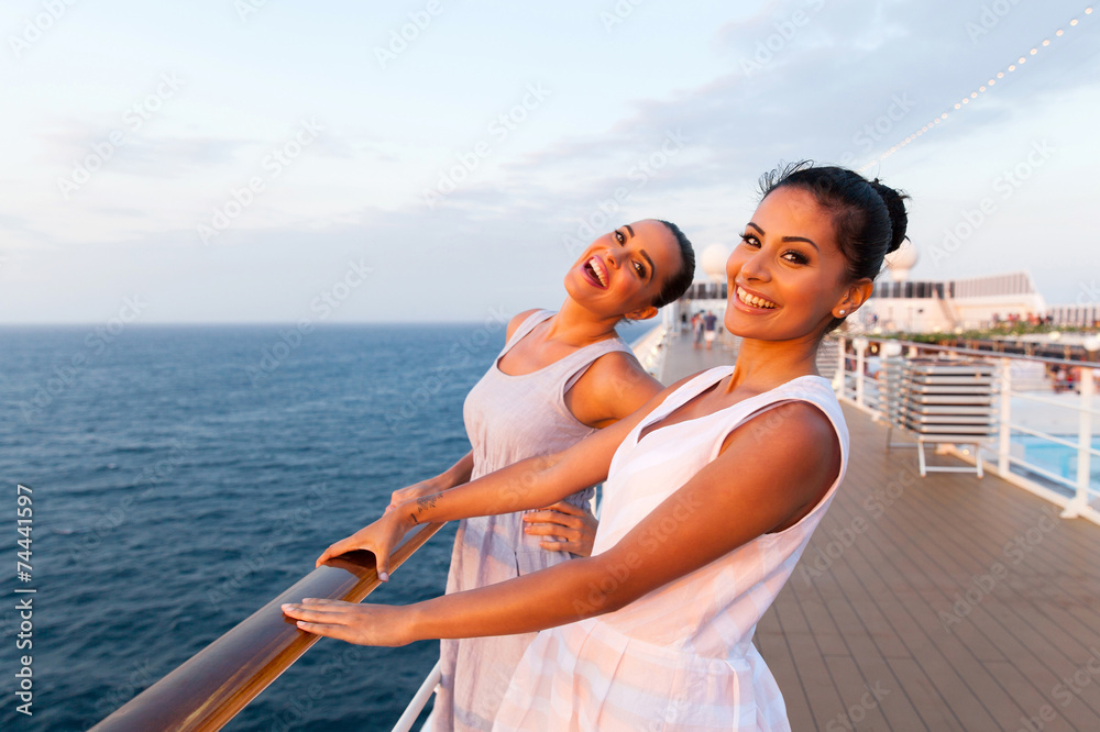 two women having fun on cruise ship - obrazy, fototapety, plakaty 