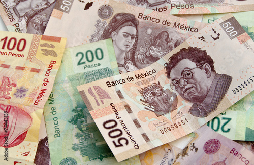 Mexican Peso bank notes background photo