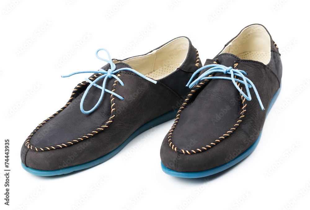 Black men's leather loafers with blue soles and laces on a white Black men's leather loafers with blue soles and laces on a white