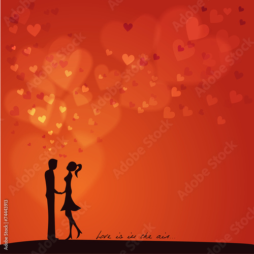 Love is in the air: Silhouette of two lovers on a red background