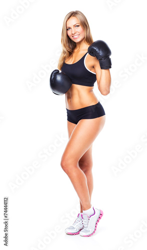 Young athletic woman in boxing gloves on a white © vladstar