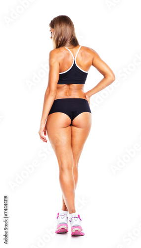 Young athletic girl on white, view from the back