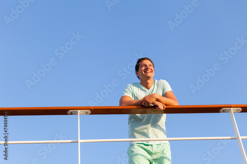 low angle view of man looking away on cruise ship