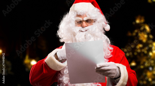 Santa Claus reading a letter photo