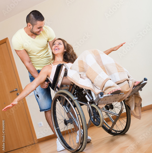 Fototapeta Naklejka Na Ścianę i Meble -  Young woman on wheelchair