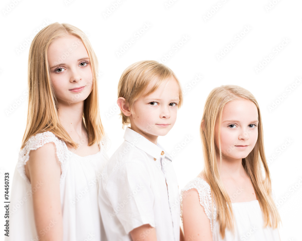 Two Sisters And Their Brother Dressed in White in the Studio