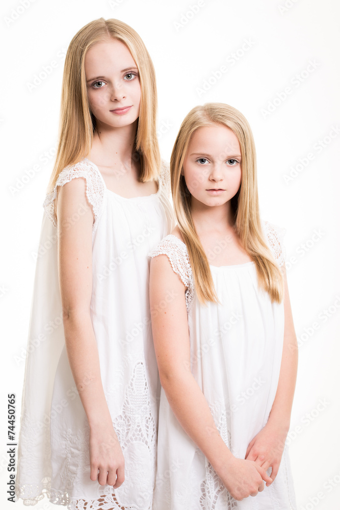 Two Beautiful Blond Teenage Girls Dressed in White. Two Beautiful Blond Teenage Girls Dressed in White.