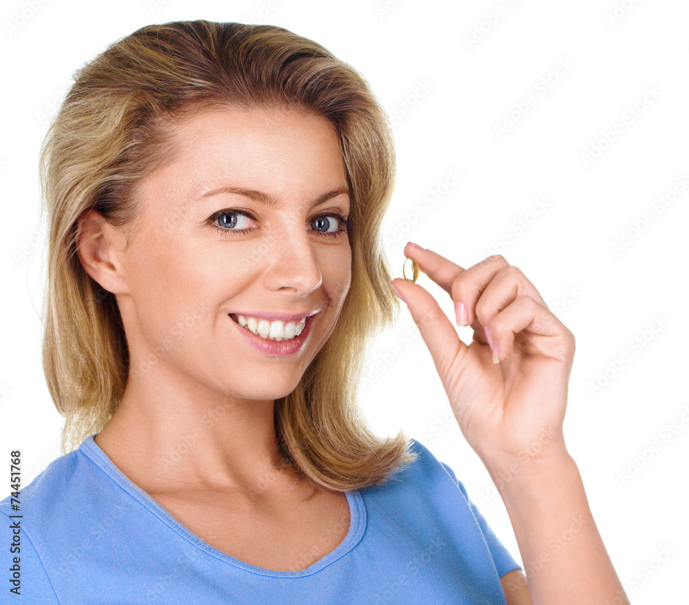 Portrait of woman with Omega 3 fish oil capsule Portrait of woman with Omega 3 fish oil capsule
