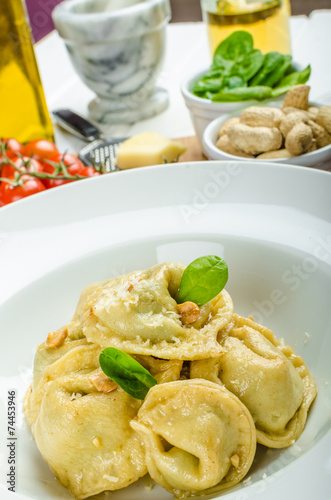 Homemade tortellini stuffed with spinach and garlic