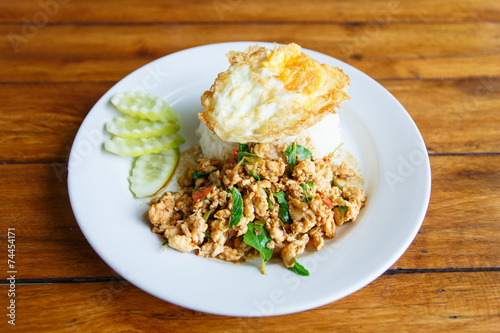 Thai spicy food basil chicken fried rice recipe with fried egg (