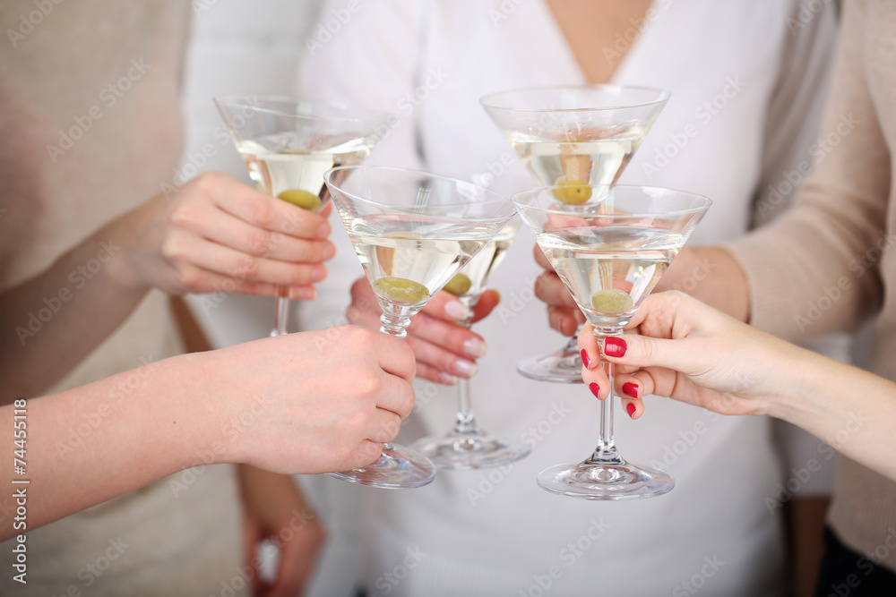 Woman hands with glasses of martini close-up Woman hands with glasses of martini close-up