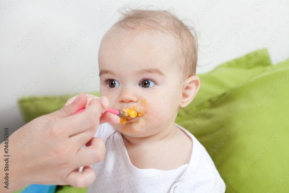 Mother feeding her baby Mother feeding her baby
