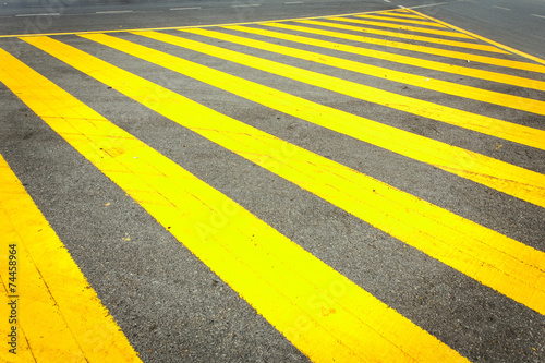 Yellow traffic line on the road © SKT Studio
