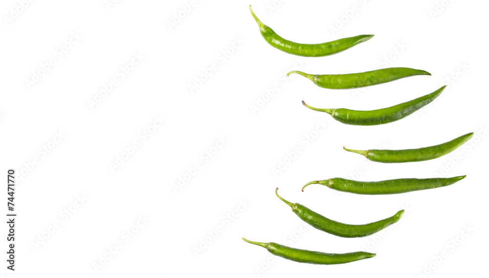 Green chili peppers over white background Green chili peppers over white background