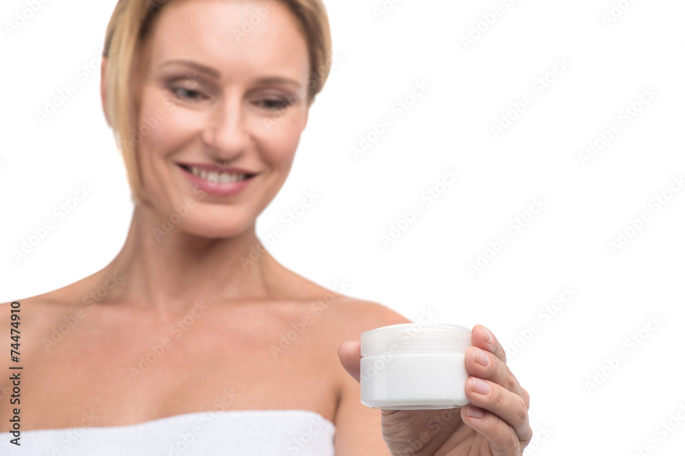 beautiful woman using skin care product, moisturizer or lotion. beautiful woman using skin care product, moisturizer or lotion.