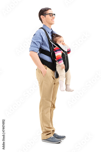 Young father carrying his baby daughter