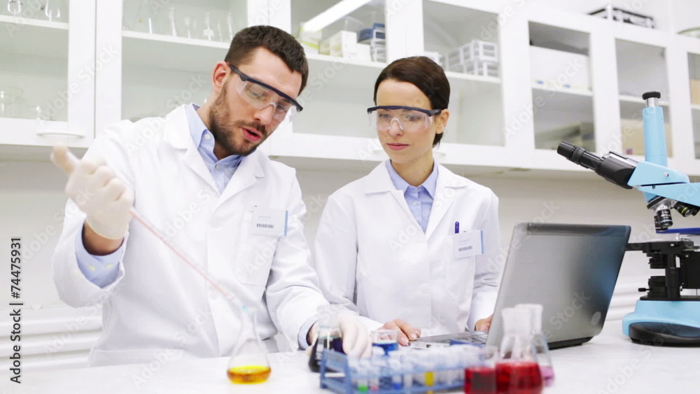 young scientists making test or research in lab young scientists making test or research in lab