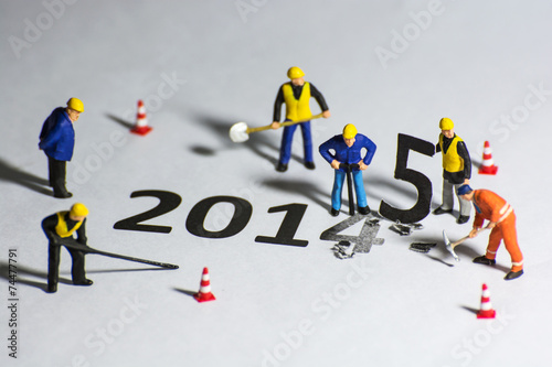 Miniature engineer change represents the new year 2014- 2015