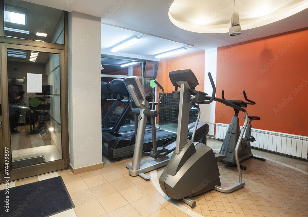 Fototapeta premium Modern gym interior with equipment