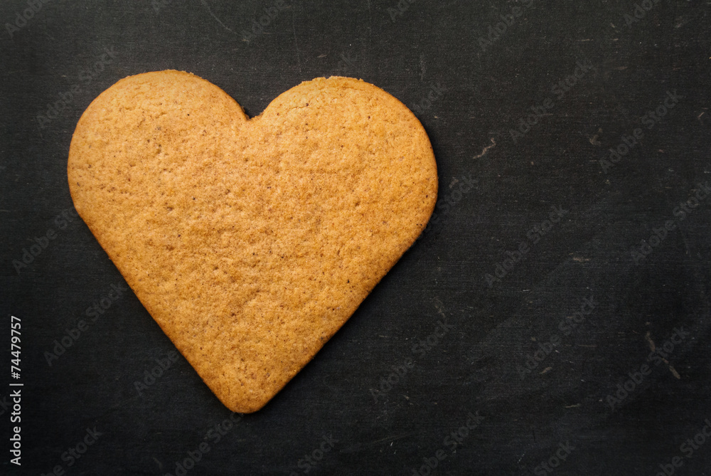 Heart Gingerbread Cookie on black background Heart Gingerbread Cookie on black background