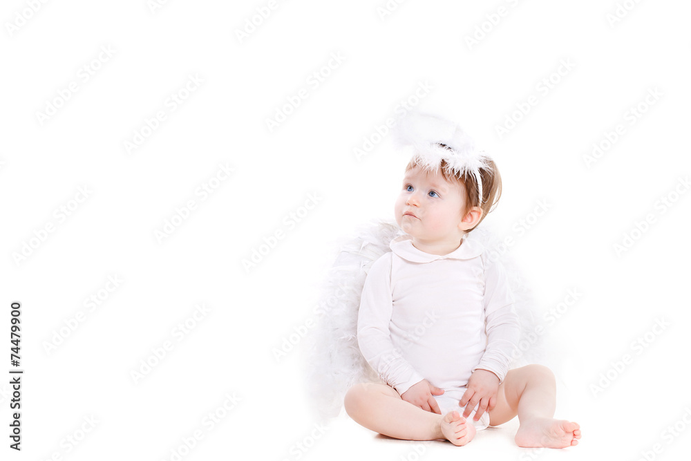 Small angel with the wings isolated on the white. Small angel with the wings isolated on the white.